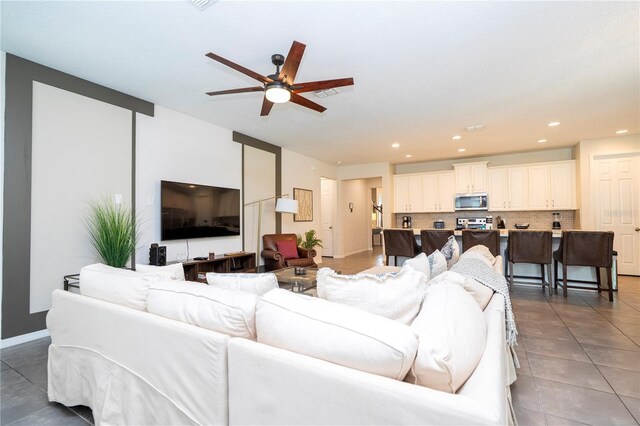1505 Nassau Point Trl, Kissimmee, FL 34747 - living area featuring a ceiling fan, tile patterned floors, recessed lighting, and baseboards