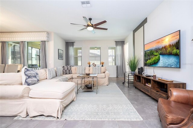1505 Nassau Point Trl, Kissimmee, FL 34747 - living room with a ceiling fan and tile patterned floors
