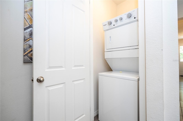 1505 Nassau Point Trl, Kissimmee, FL 34747 - laundry area featuring stacked washing machine and dryer