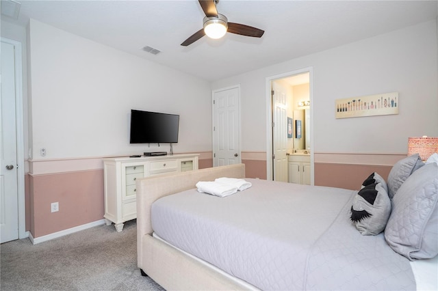 1505 Nassau Point Trl, Kissimmee, FL 34747 - bedroom featuring carpet, baseboards, connected bathroom, and a ceiling fan
