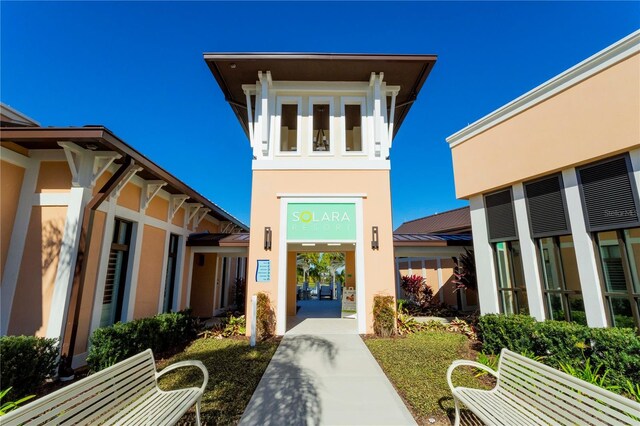 1505 Nassau Point Trl, Kissimmee, FL 34747 - doorway to property with stucco siding, metal roof, and a standing seam roof