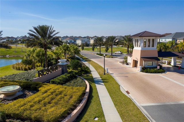 1505 Nassau Point Trl, Kissimmee, FL 34747 - view of decorative road featuring a residential view, curbs, and a water view