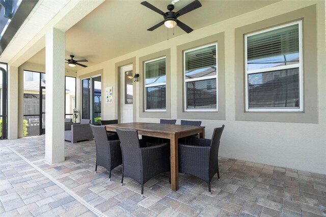 1505 Nassau Point Trl, Kissimmee, FL 34747 - view of patio / terrace with ceiling fan and outdoor dining area