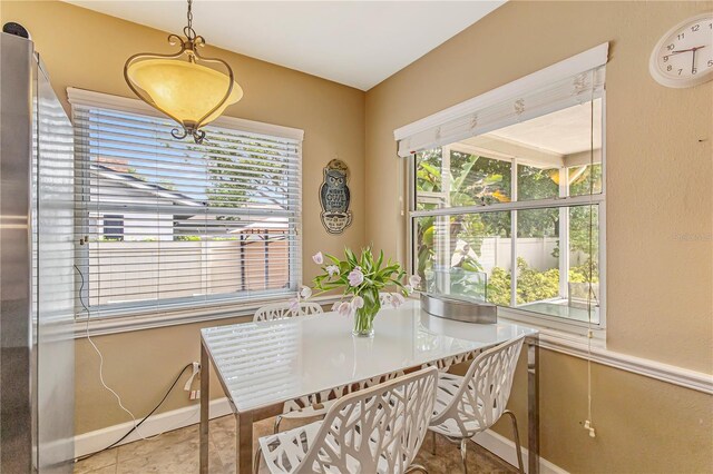676 Dunblane Dr, Winter Park, FL 32792 - dining area with plenty of natural light, baseboards, and tile patterned flooring