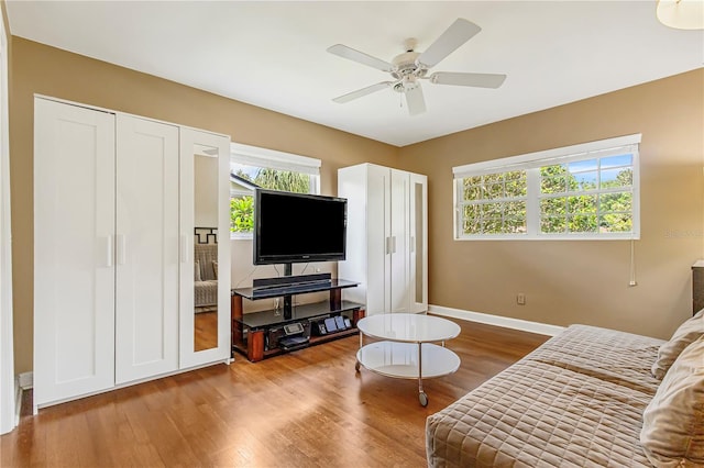 676 Dunblane Dr, Winter Park, FL 32792 - living room with plenty of natural light, wood finished floors, a ceiling fan, and baseboards