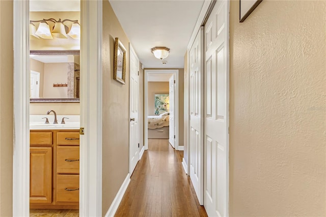 676 Dunblane Dr, Winter Park, FL 32792 - hall with a sink, hardwood / wood-style flooring, and baseboards