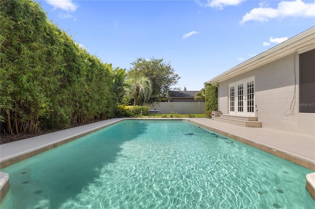 676 Dunblane Dr, Winter Park, FL 32792 - view of swimming pool with french doors and a patio area