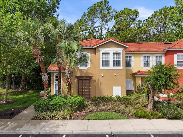 8507 Crystal Cove Loop, Kissimmee, FL 34747 - view of front facade with a tiled roof and stucco siding