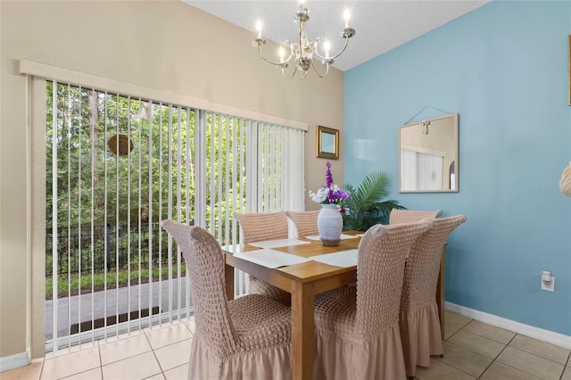 8507 Crystal Cove Loop, Kissimmee, FL 34747 - dining room featuring a chandelier, tile patterned floors, baseboards, and vaulted ceiling
