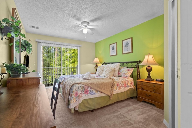 8507 Crystal Cove Loop, Kissimmee, FL 34747 - bedroom featuring access to outside, carpet floors, a textured ceiling, and ceiling fan