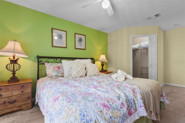 8507 Crystal Cove Loop, Kissimmee, FL 34747 - bedroom with carpet, a textured ceiling, a closet, a ceiling fan, and baseboards