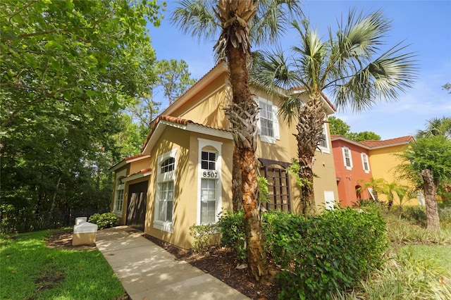 8507 Crystal Cove Loop, Kissimmee, FL 34747 - view of front of home with stucco siding