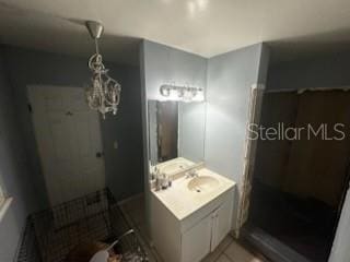 1511 Hobson St, Longwood, FL 32750 - bathroom with vanity, tiled shower, and tile patterned flooring