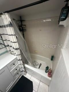 1511 Hobson St, Longwood, FL 32750 - full bathroom with shower / bath combo with shower curtain and tile patterned flooring