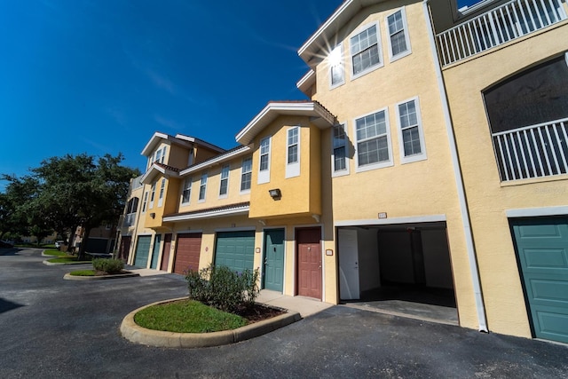 12106 Poppy Field Ln Unit 107, Orlando, FL 32837 - view of property with a garage and driveway