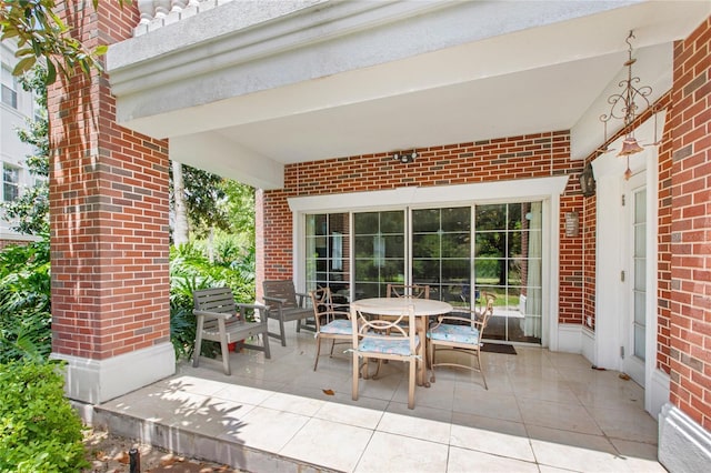 7650 Whisper Way Unit 104, Reunion, FL 34747 - view of patio / terrace with outdoor dining area