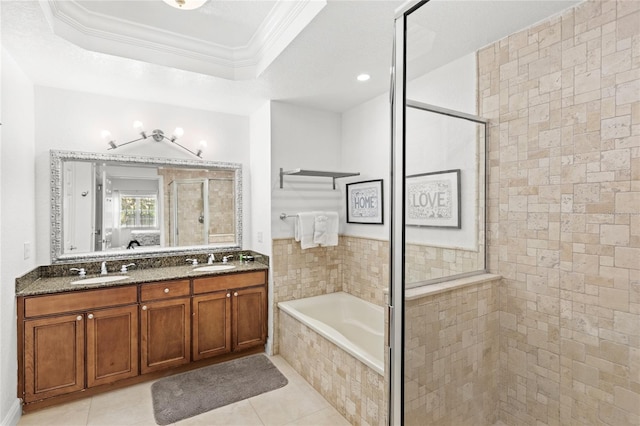 7650 Whisper Way Unit 104, Reunion, FL 34747 - ensuite bathroom with tiled shower, a garden tub, ornamental molding, a raised ceiling, and double vanity