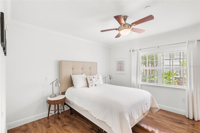 7650 Whisper Way Unit 104, Reunion, FL 34747 - bedroom featuring baseboards, wood finished floors, ornamental molding, and ceiling fan