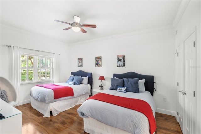 7650 Whisper Way Unit 104, Reunion, FL 34747 - bedroom with crown molding, wood finished floors, a ceiling fan, and baseboards