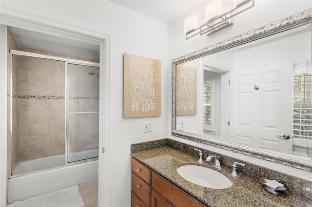 7650 Whisper Way Unit 104, Reunion, FL 34747 - full bathroom with vanity, shower / bath combination with glass door, and tile patterned floors