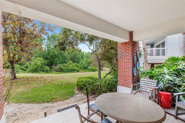 7650 Whisper Way Unit 104, Reunion, FL 34747 - view of patio / terrace with outdoor dining space