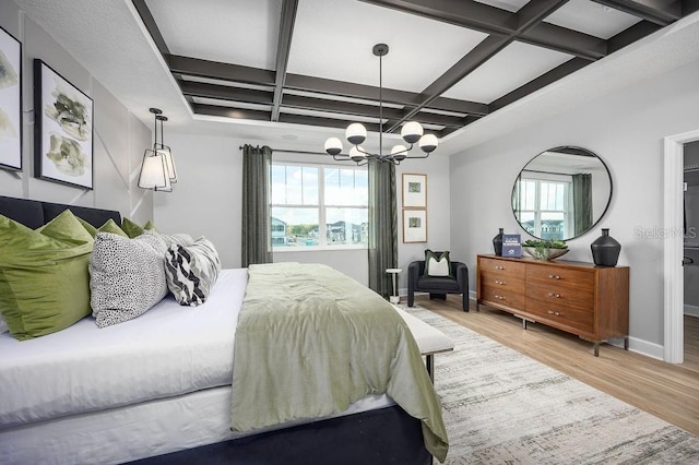 1341 Lumpini St, Saint Cloud, FL 34771 - bedroom featuring coffered ceiling, wood finished floors, multiple windows, a chandelier, and baseboards
