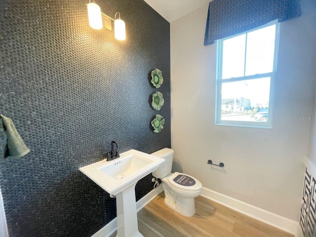 1341 Lumpini St, Saint Cloud, FL 34771 - half bath with wood finished floors, toilet, and baseboards