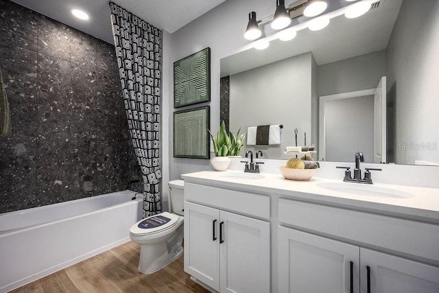 1341 Lumpini St, Saint Cloud, FL 34771 - bathroom featuring toilet, double vanity, shower / bath combo, and wood finished floors