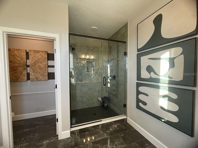 1341 Lumpini St, Saint Cloud, FL 34771 - full bathroom featuring a shower stall, baseboards, marble look tiles, and a textured ceiling