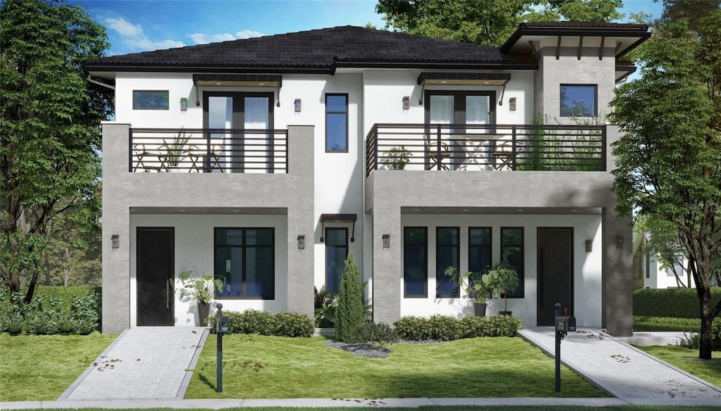 523 W Princeton St Unit 1, Orlando, FL 32804 - modern home with french doors, a balcony, stucco siding, and a front lawn