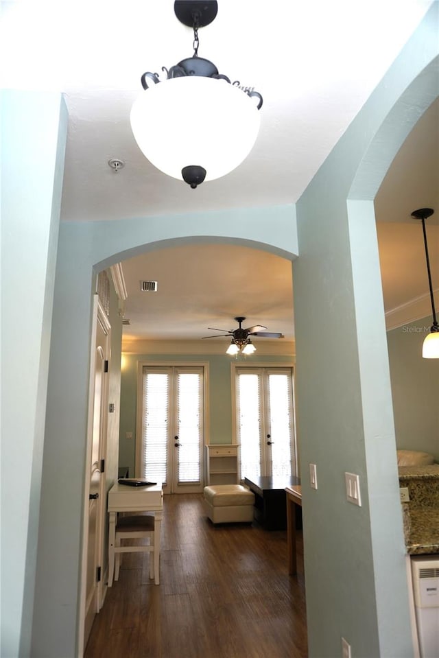 1320 NW 3rd Ave Unit 238, Gainesville, FL 32603 - corridor featuring french doors, arched walkways, and wood finished floors