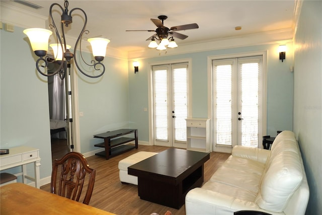 1320 NW 3rd Ave Unit 238, Gainesville, FL 32603 - living room featuring french doors, ceiling fan, wood finished floors, ornamental molding, and a chandelier
