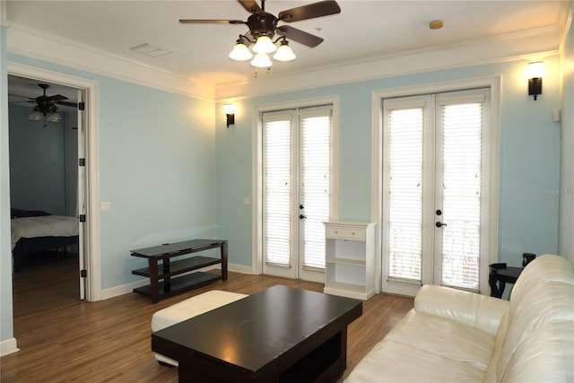 1320 NW 3rd Ave Unit 238, Gainesville, FL 32603 - living room featuring french doors, a ceiling fan, wood finished floors, ornamental molding, and baseboards
