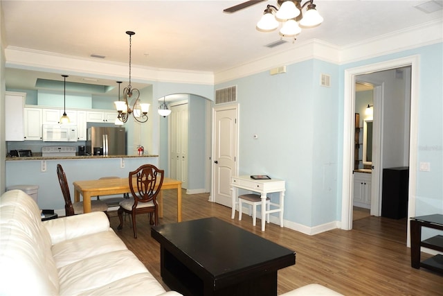 1320 NW 3rd Ave Unit 238, Gainesville, FL 32603 - living area with arched walkways, ceiling fan, wood finished floors, crown molding, and baseboards