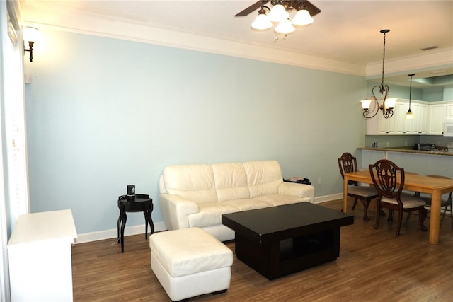 1320 NW 3rd Ave Unit 238, Gainesville, FL 32603 - living room featuring ornamental molding, ceiling fan, baseboards, and dark wood finished floors