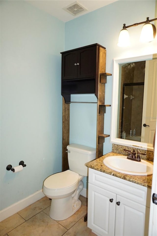 1320 NW 3rd Ave Unit 238, Gainesville, FL 32603 - full bath featuring tile patterned flooring, toilet, vanity, tiled shower, and baseboards