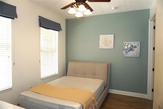 1320 NW 3rd Ave Unit 238, Gainesville, FL 32603 - bedroom featuring wood finished floors, baseboards, and ceiling fan