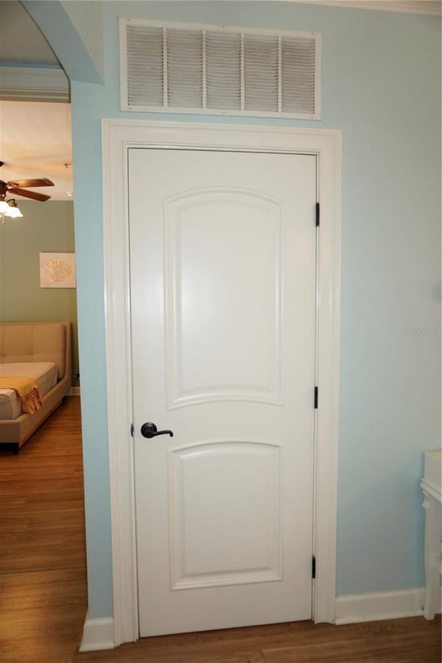 1320 NW 3rd Ave Unit 238, Gainesville, FL 32603 - detailed view of wood finished floors, a ceiling fan, and baseboards