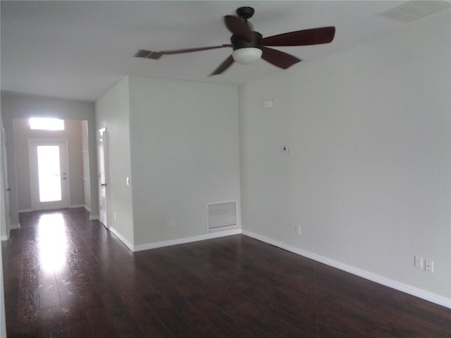 2451 Strandhill St, Orlando, FL 32824 - spare room with wood finished floors, a ceiling fan, and baseboards