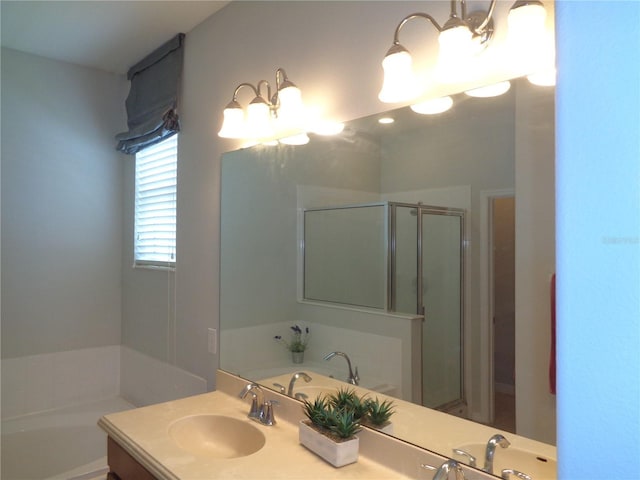 2451 Strandhill St, Orlando, FL 32824 - full bathroom featuring double vanity, a bath, and a stall shower