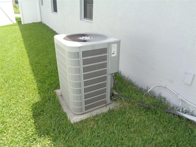 2451 Strandhill St, Orlando, FL 32824 - exterior view of central air condition unit and stucco siding