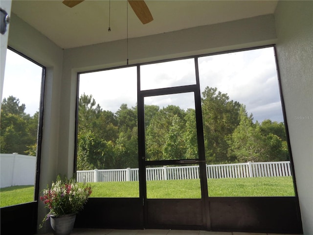 2451 Strandhill St, Orlando, FL 32824 - sunroom featuring ceiling fan, healthy amount of natural light, and a wooded view