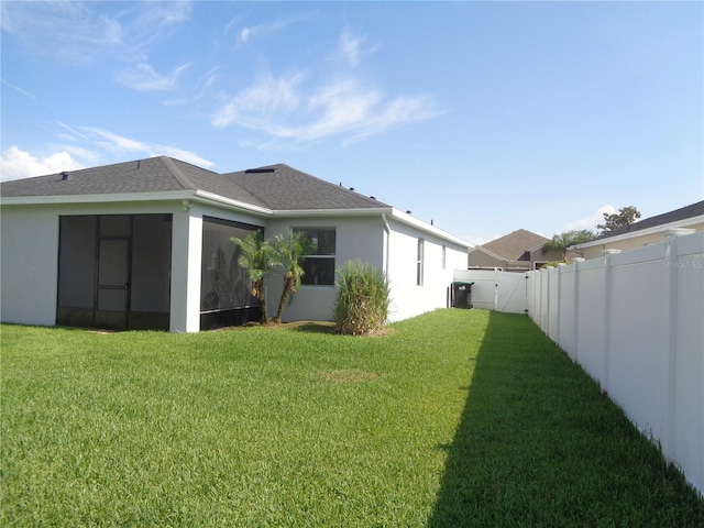 2451 Strandhill St, Orlando, FL 32824 - back of house featuring a sunroom and stucco siding