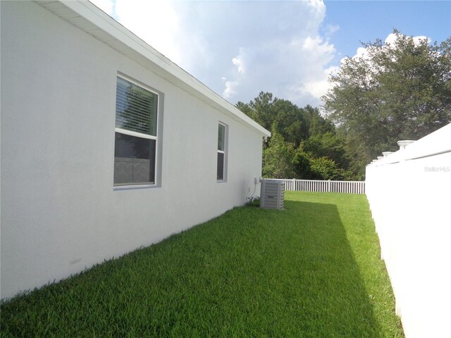 2451 Strandhill St, Orlando, FL 32824 - view of yard featuring central AC