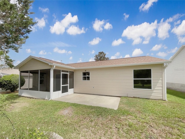 9514 SE 168th Maplesong Ln, The Villages, FL 32162 - rear view of house with a sunroom, a patio, a yard, and roof with shingles