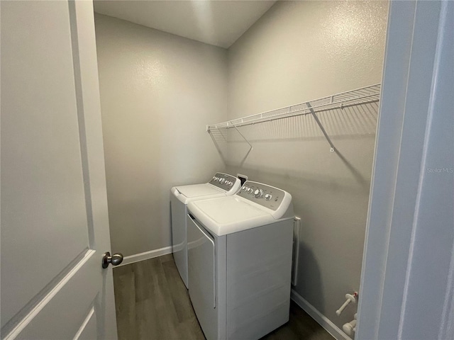 1356 Lumpini St, Saint Cloud, FL 34771 - laundry area with separate washer and dryer and dark wood-type flooring