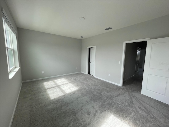 1356 Lumpini St, Saint Cloud, FL 34771 - unfurnished bedroom with carpet flooring and baseboards