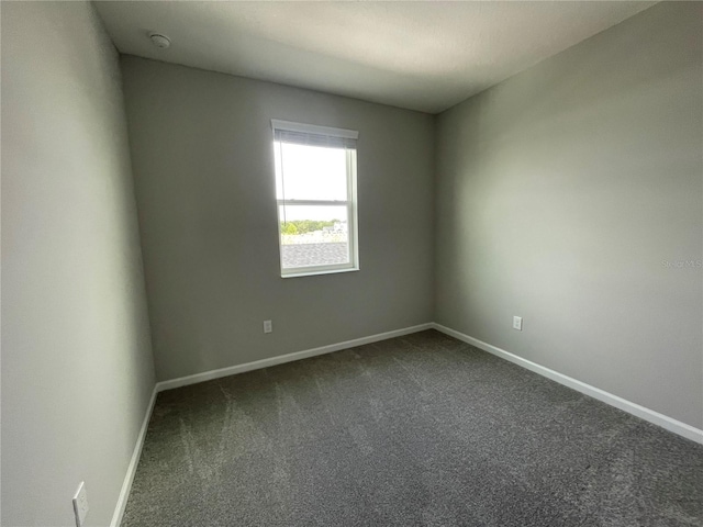 1356 Lumpini St, Saint Cloud, FL 34771 - spare room with dark colored carpet and a smoke detector