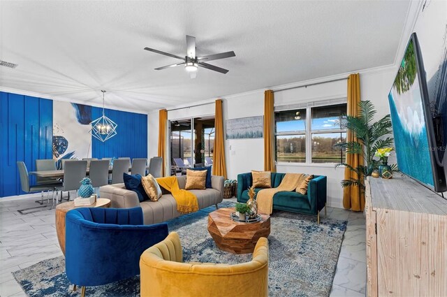 4161 Paragraph Dr, Kissimmee, FL 34746 - living area featuring crown molding, marble finish floors, a chandelier, and a ceiling fan