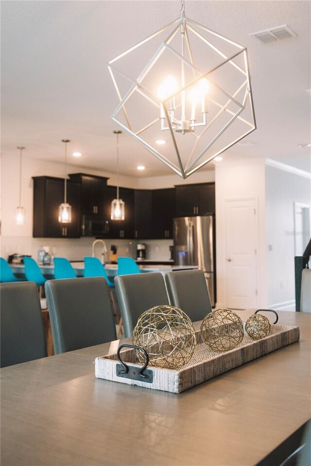 4161 Paragraph Dr, Kissimmee, FL 34746 - dining space featuring recessed lighting and a chandelier